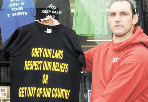 ARREST THREAT: Matthew Taylor and the T-shirt police have forced him to remove from display