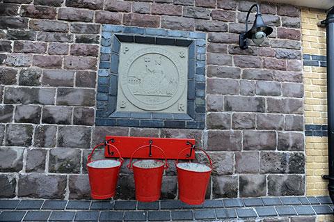 Bright red fire buckets at the Pontypool and Blaenavon Railway