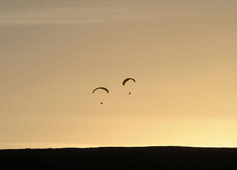 PIC OF THE DAY 28.11.13: Paragliders enjoy the late evening sun near Blaenavon Picture: MARK LEWIS
