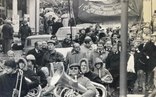 There is still a shortage of jobs in former mining communities, 40 years after the major miners strike. Image: Striking miners parade through the streets of Blackwood