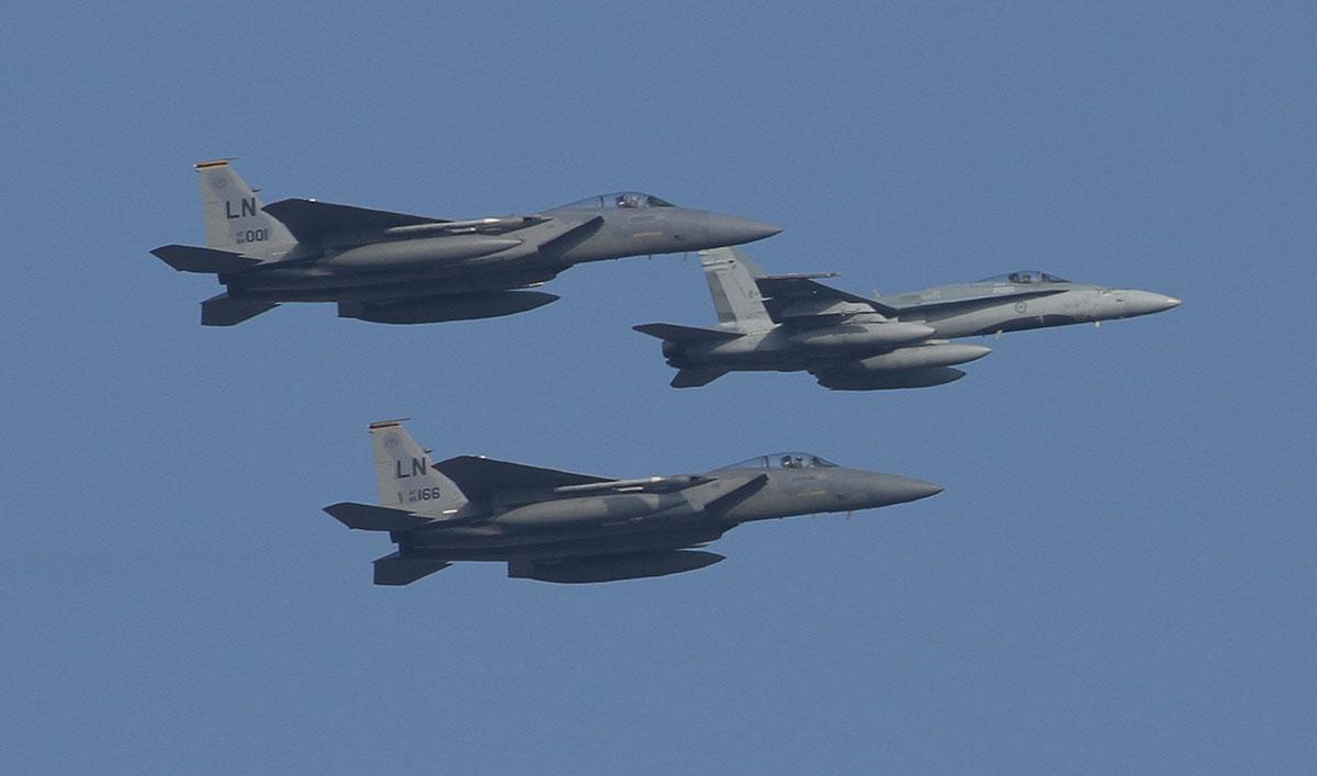 A Royal Canadian Air Force F-18 and two US Air Force F-15 Eagles. Pic by John-Walker.