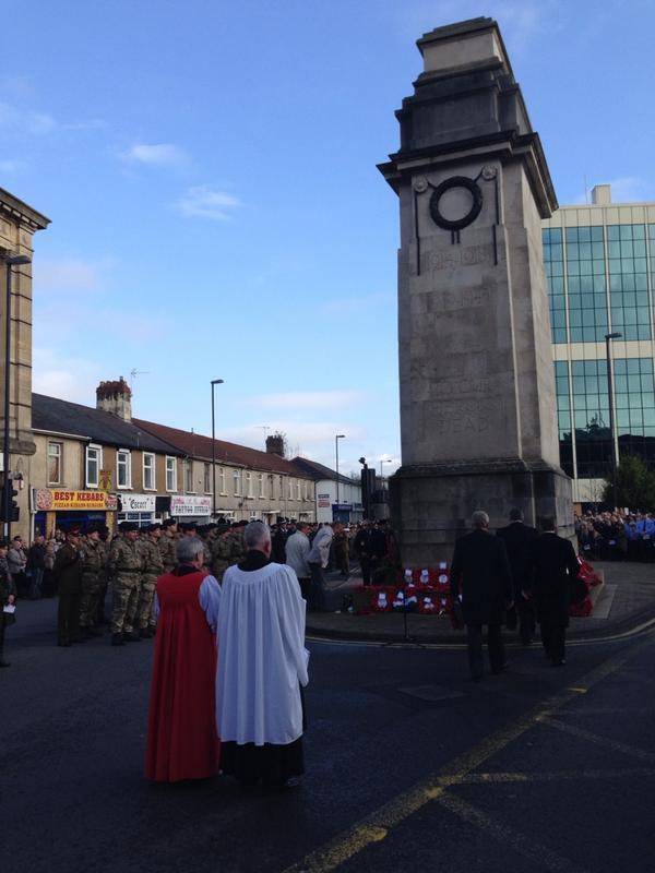 Crowds watch as wreaths are laid at the Cenotaph in Newport