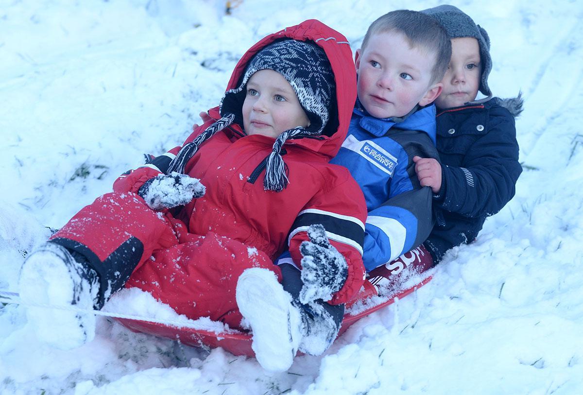 Kaylum Jones, Lucas Jones and TJ Robinson on a sled enjoying the snow in Trevethin. Pic: Michael Eden 