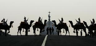 Indian Border Security force soldiers mounted on camels stand during a rehearsal of Beating Retreat ceremony, in New Delhi