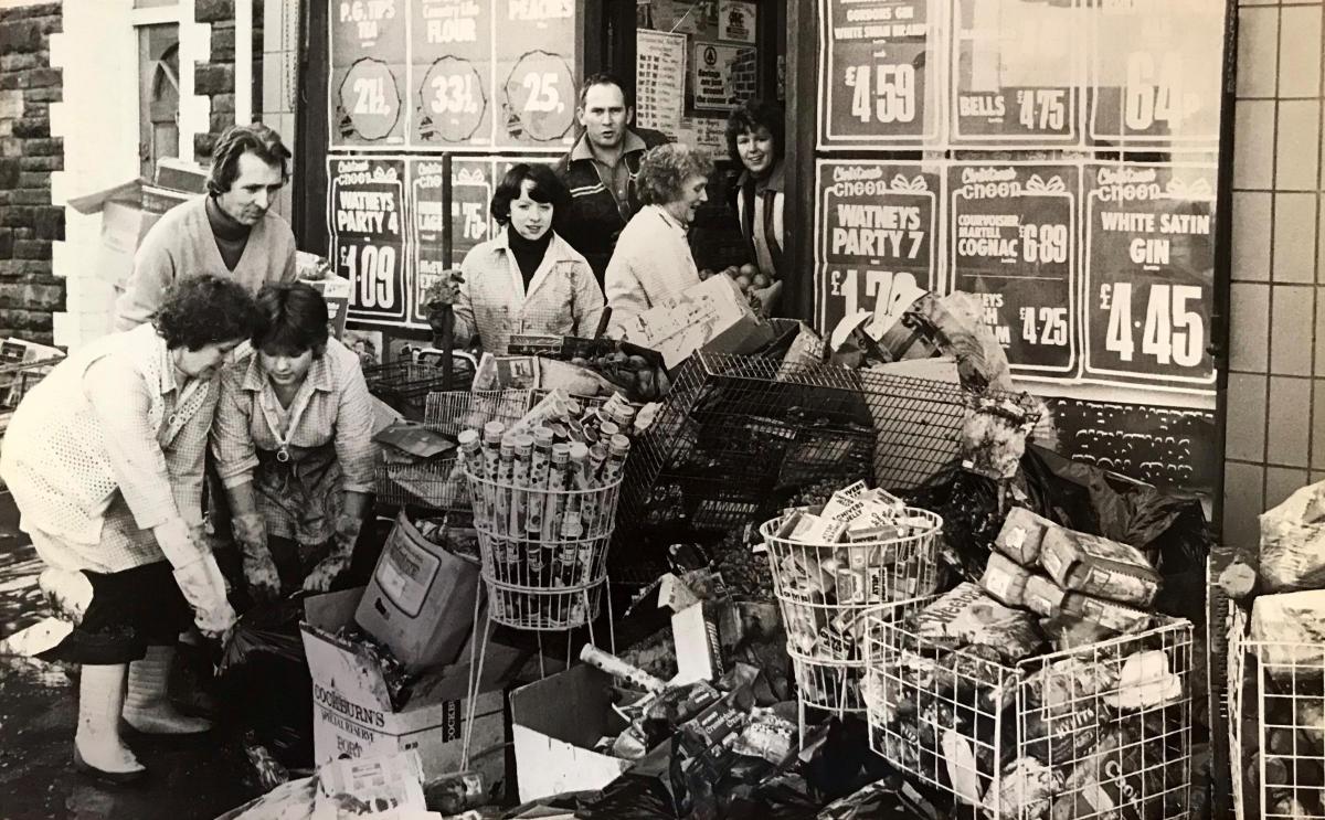 Supermarket staff in Risca clean up after floods caused by heavy rain in 1979