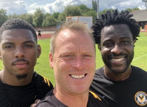 South Wales Argus: TRAINING: Wilfried Bony, right, with Newport County boss Michael Flynn, centre, and Tristan Abrahams