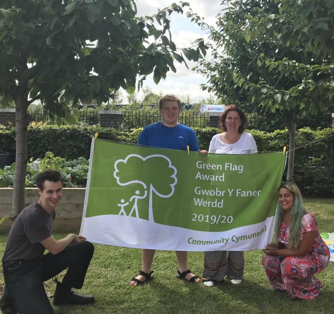 Volunteers celebrate their Green Flag Community Award