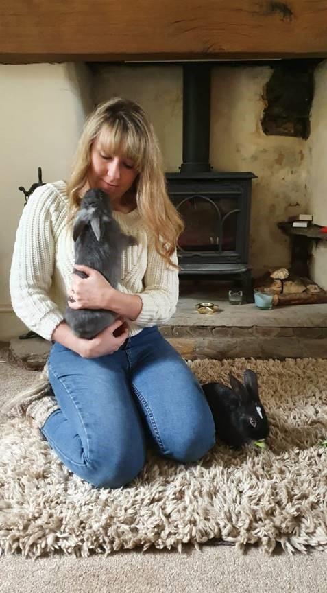 Laura Drummond is a volunteer foster carer for two rabbits from Blue Cross in Newport. The charity are looking for more people like her to help them care for the animals. Picture: Blue Cross