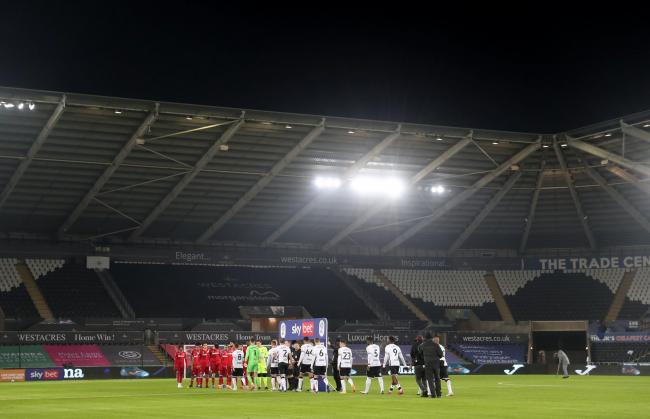 Swansea and Reading players shake hands before the Championship clash at the Liberty Stadium