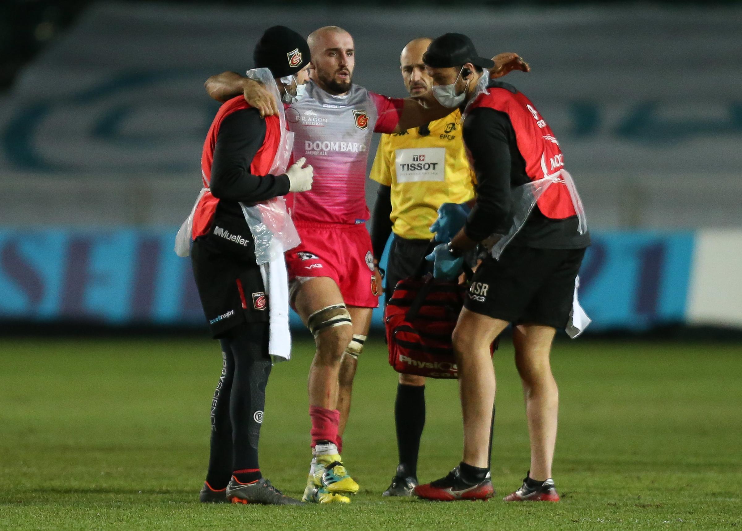 UNLUCKY: Ollie Griffiths is helped from the field against Wasps
