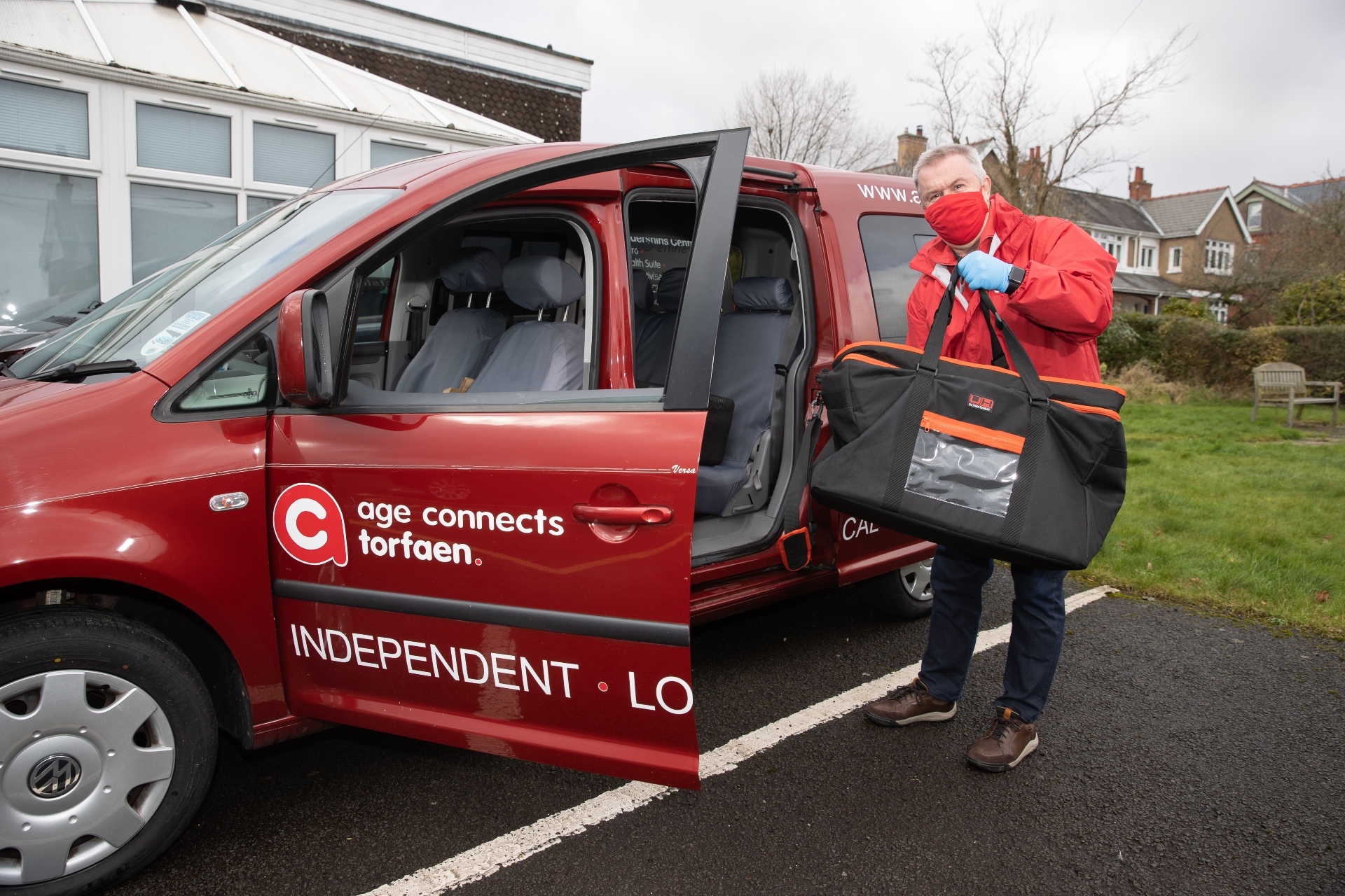 Driver Steve Watkins from Age Connects Torfaen loading up meals to take out into the community. Picture: Age Connects Torfaen.