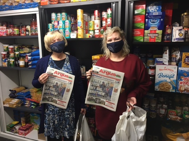 Dawn Derraven (L) and Tara Holloway (R) of Risca Covid19 Volunteers with some of the Admiral sponsored free papers to be included into their food boxes.