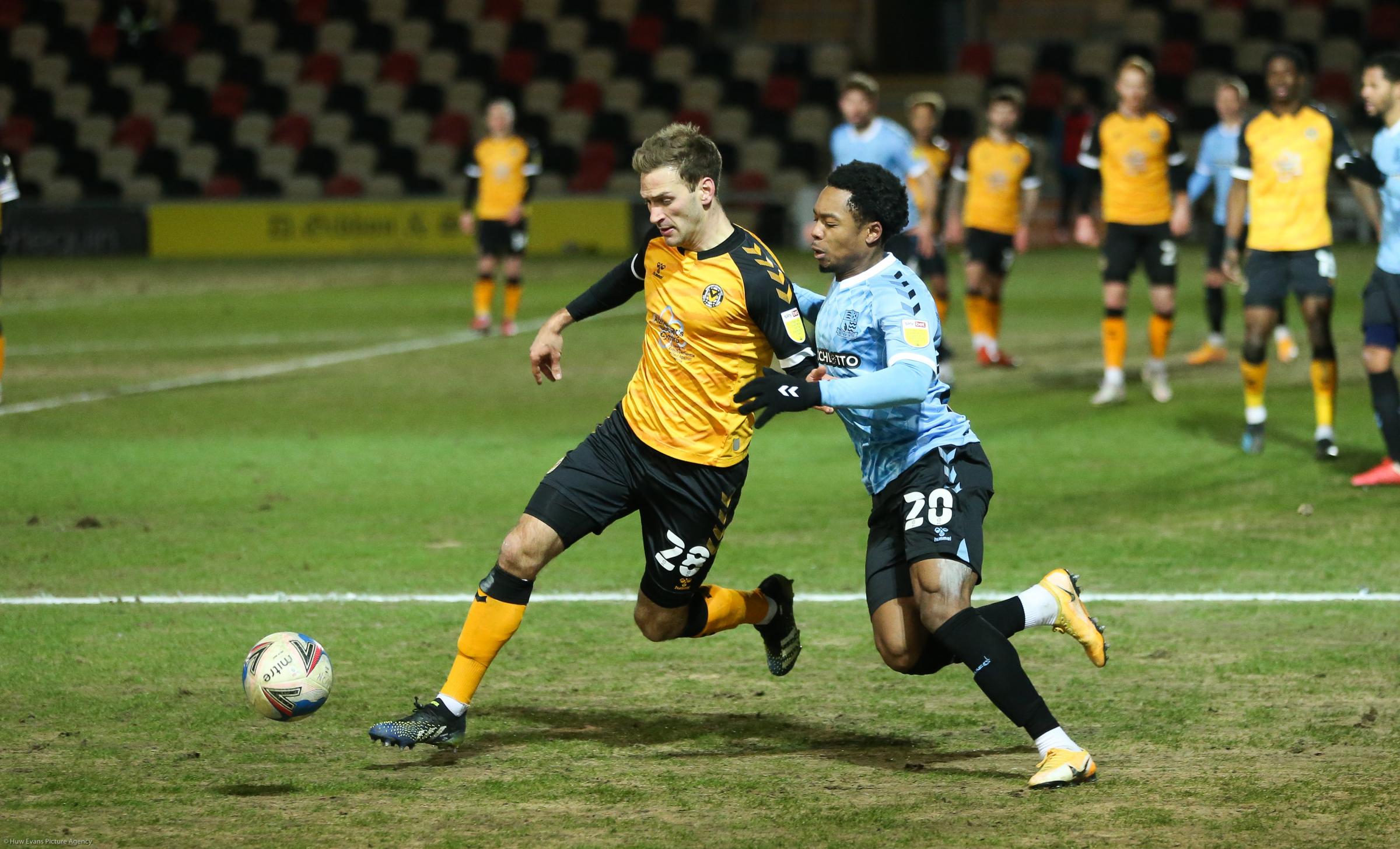 BATTLING: Mickey Demetriou in action for Newport County AFC