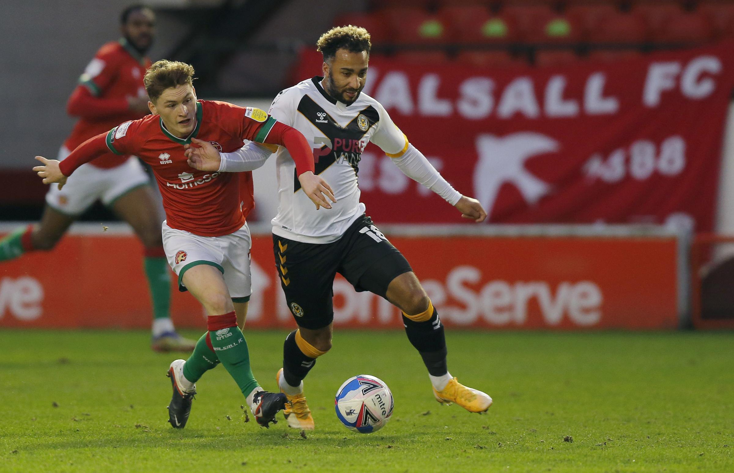 Nicky Maynard on the run. Newport County fared better on the grass in Walsall after the challenging home conditions