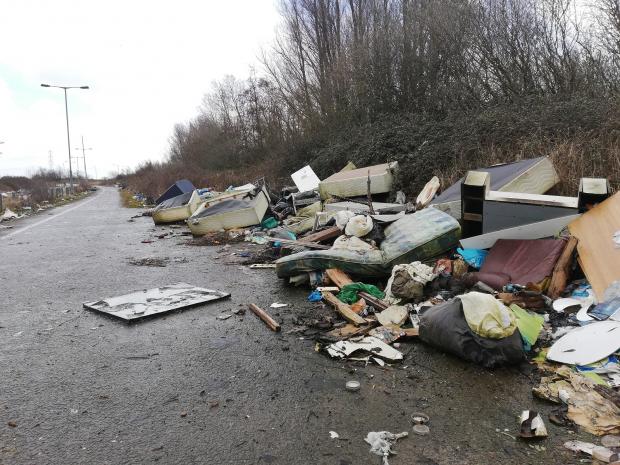 South Wales Argus: Mattresses, bed frames and other household waste dumped illegally in western Newport. Picture: The National