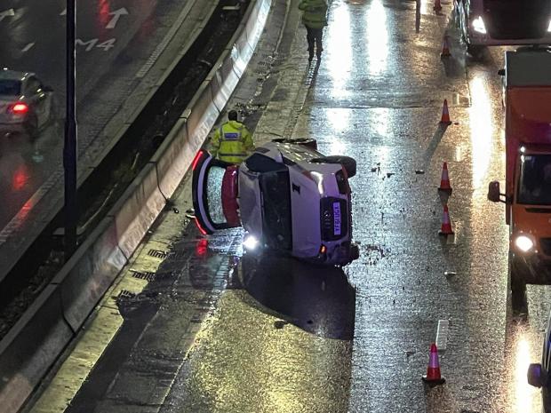 South Wales Argus: Rolled over car on the M4 motorway near the Coldra Pictures: Gabor Futo