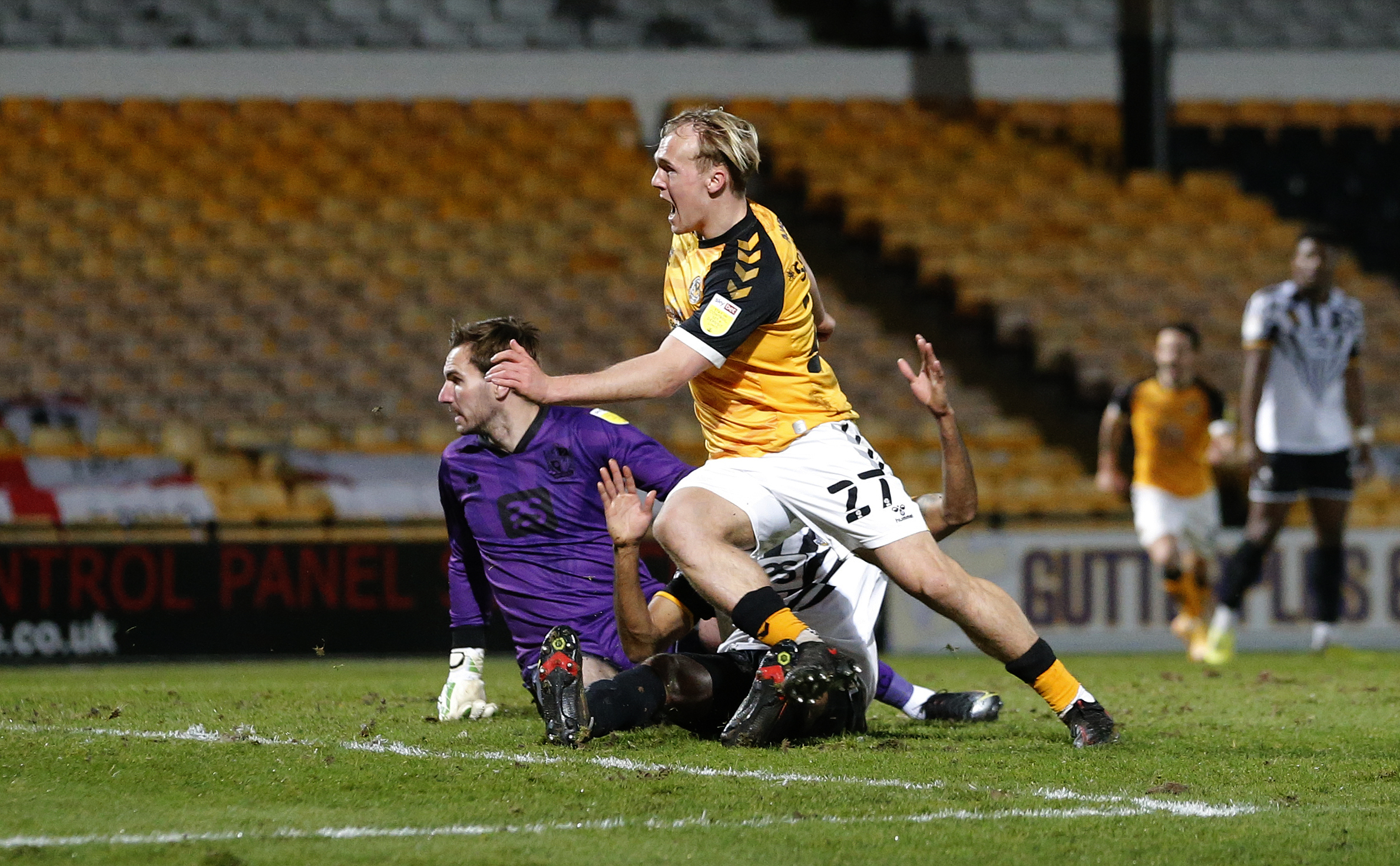 16.03.21 - Port Vale v Newport County - Sky Bet League 2 - Jack Scrimshaw of Newport County shoots past Cristian Montano of Port Vale and Goalkeeper Scott Brown of Port Vale to score their 1st goal