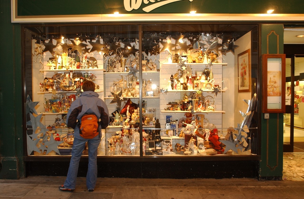 FESTIVE: A shopper looking at the window display of Wildings in Newport