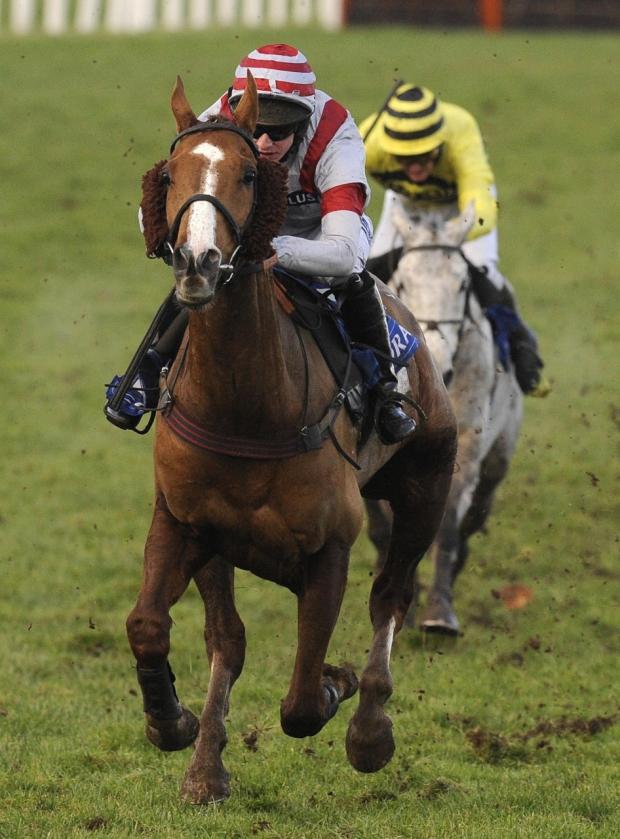 South Wales Argus: BATTLE: Dream Alliance and Tom O'Brien kick clear of Silver By Nature on the run-in to win The Coral Welsh National at Chepstow Racecourse, Gwent, Wales in December 2009. Photo: Alan Crowhurst/PA Wire.