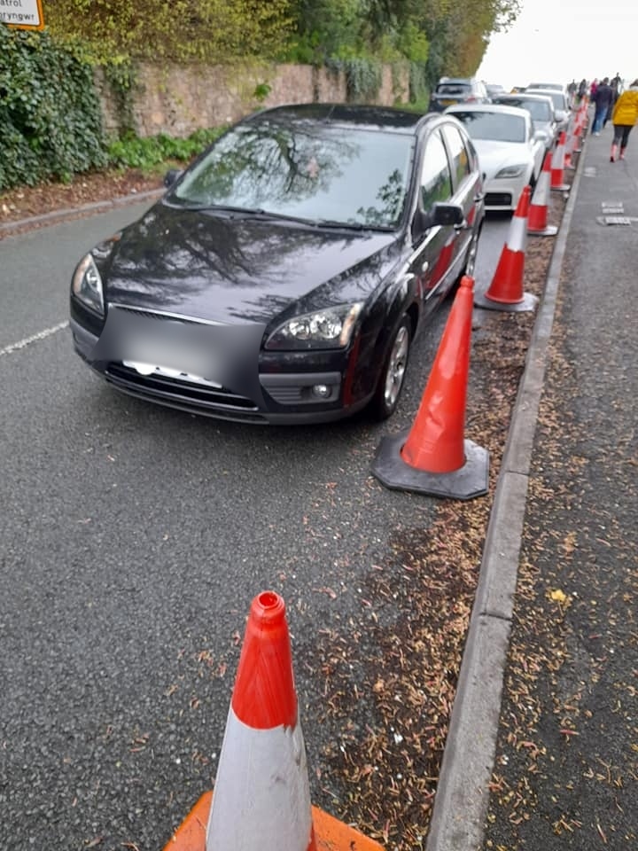 Cars have been parking next to the cones placed to stop parking there. 
