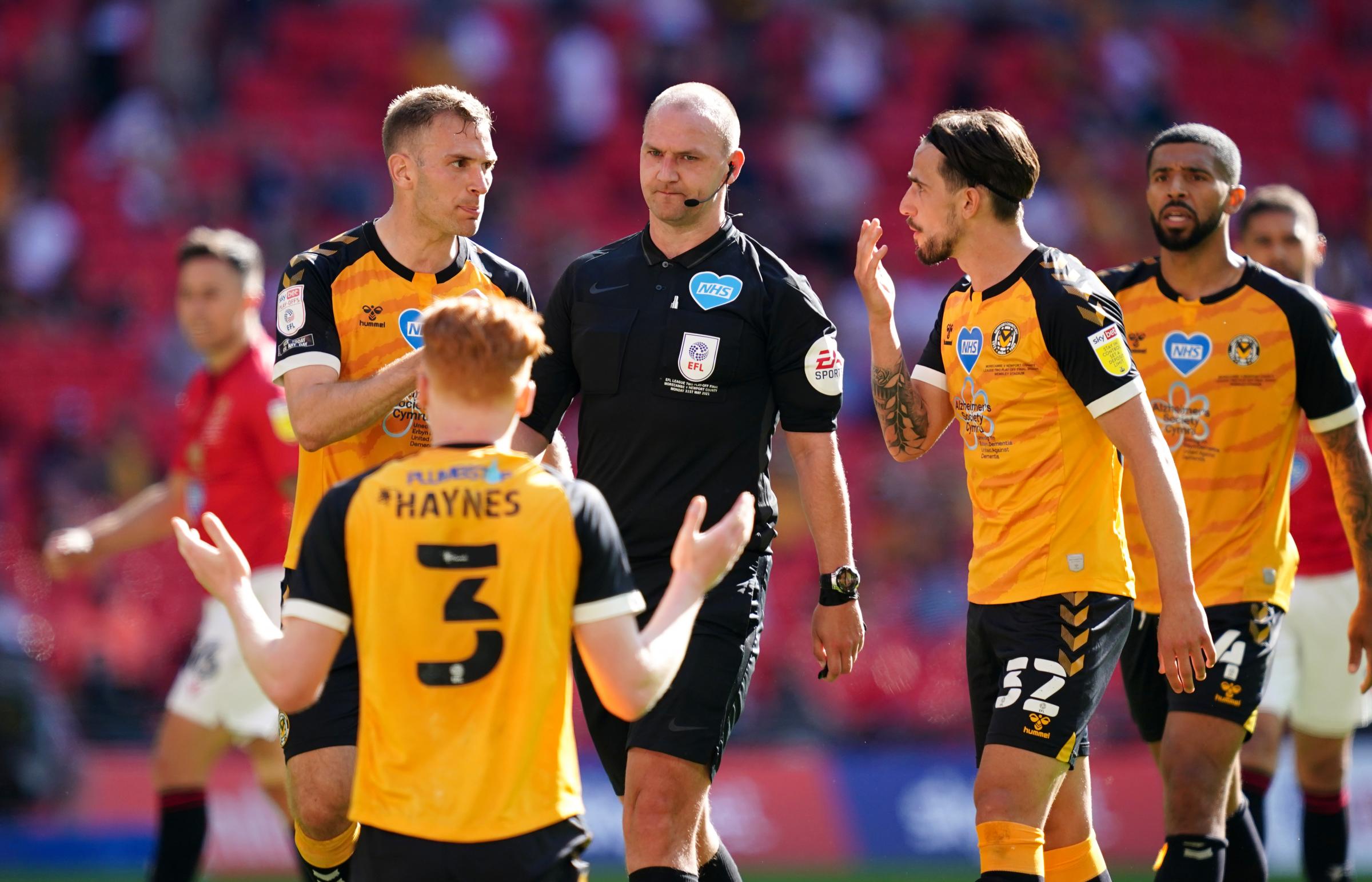 CONTROVERSIAL: Countys Ryan Haynes pleads innocence after referee Bobby Madley awards a penalty to Morecambe