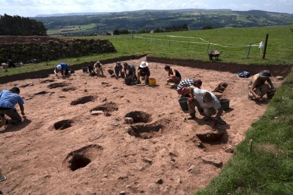 South Wales Argus: Archaeologists at Arthur's Stone, a Stone Age monument in Herefordshire. Picture: University of Manchester South Wales Argus: Archaeologists at Arthur's Stone, a Stone Age monument in Herefordshire. Picture: University of Manchester