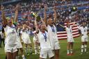 PRIDE: United States star Megan Rapinoe, centre, lifts the Women’s World Cup trophy
