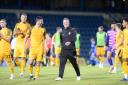 VICTORY: Newport County manager Michael Flynn and his players enjoyed their win at Gillingham in the Carabao Cup