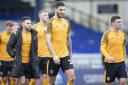 DEJECTED: Defender Ryan Inniss leads the Newport County players off the pitch after Saturday's 5-0 defeat at Oldham Athletic.