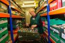 Volunteers at the Newport Foodbank in Malpas check the warehouse