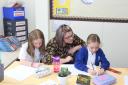 Teaching: Brady Edwards with two of her pupils