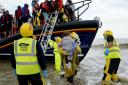 The RNLI assisting asylum seekers who've crossed the English channel to come to Britain. A government scheme requires all local authorities to care for some children who arrive without an adult.