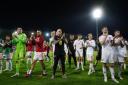 RELIEF: Rob Page with his players after Wales win in Latvia