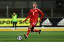Newport County defender Matt Baker on the ball for Wales U21s