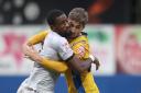 MARKED: County's Omar Bogle can't escape Lewis Brunt at Mansfield