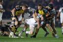 BACK: Dragons lock Ben Carter, right, makes a tackle against the Ospreys in November