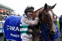 VICTORY: Caoilin Quinn celebrates winning The Coral Welsh Grand National Handicap Chase on Nassalam at Chepstow Racecourse