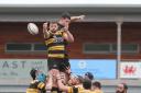 Ben Roach of Newport RFC goes up for the ball from the line out