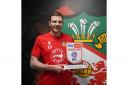 Wrexham striker Paul Mullin with his award. Picture by WREXHAM AFC