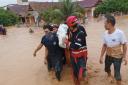 A search and rescue team worked to evacuate residents using rubber boats and other vehicles (Wajo Regional Disaster Management Agency via AP)