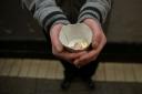 A ban on beggars near city centre cash machines is being considered