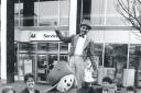 Staff from the AA Service shop with Gryff and man on stilts Maxey and Lisa Watkins promoting the festival in 1992