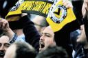 SUPPORT: A Newport County fan salutes the team after they defeat Grimsby Town