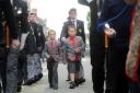 Rougemont School pupils Lewis Evans and Owain Stephens march alongside veterans