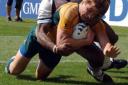 CRUISING: Australia's Drew Mitchell crosses the line for a try against Fiji
