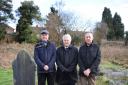 COMMEMORATION: Private Jobbins’ great grandsons (from left) Alan Cook, Mansel Young and Terry Young at the grave