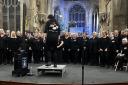 The choirs raised £14,000