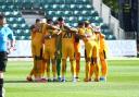 TOGETHER: The Newport County players in a pre-match huddle before Saturday's draw with Exeter City