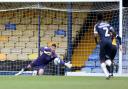 MOVE: Goalkeeper Tom King, pictured saving a penalty for County at Southend, has signed for Salford