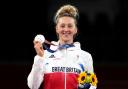 Great Britain's Lauren Williams celebrates with the silver medal after the Women's 67kg Gold Medal contest at the Makuhari Messe Hall A on the third day of the Tokyo 2020 Olympic Games in Japan. Picture: Martin Rickett/PA Wire